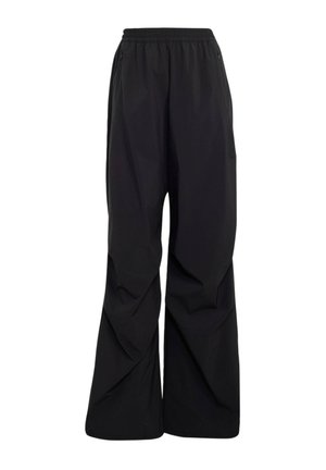 Locker sitzende schwarze Hose mit elastischem Bund und seitlichen Reißverschlusstaschen, weite Beine mit dezenten Nahtdetails.
