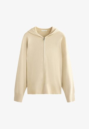 Beige neulottu vetoketjullinen huppari, jossa pitkät hihat ja resorit hihoissa ja helmassa, esitetty yksivärisellä valkoisella taustalla.