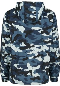 Blue, black, and white camouflage patterned hooded jacket with elastic cuffs, shown from the back.