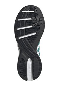 Sko sula i svart gummi med vita accenter. Texturerad yta med spår och fördjupningar, med cirkulär detalj nära hälområdet.