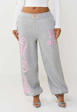 - Spodnie materiałowe