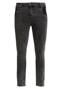 Svarta jeans i denim med en blekt finish, avsmalnande passform och två framfickor med diskreta sömnadsdetaljer.