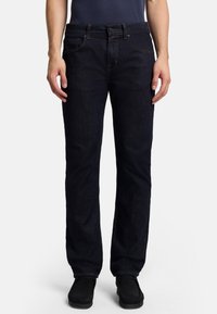 Mörkblå denimjeans med rak bendesign, fem fickor, subtila sömnadsdetaljer och medelhög midja.