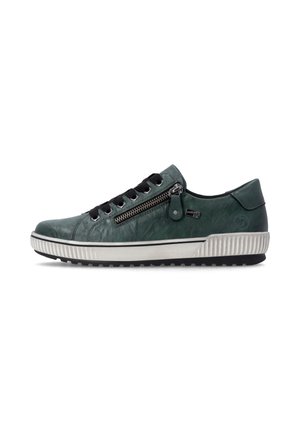 Baskets basses vert foncé avec lacets noirs, fermeture éclair latérale et semelle blanche texturée.