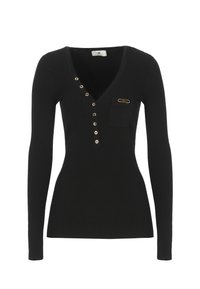 Schwarzes Langarmoberteil mit gerippter Textur, V-Ausschnitt, goldfarbene Knöpfe auf einer Seite, kleine Tasche und goldfarbige Hardware-Akzent.