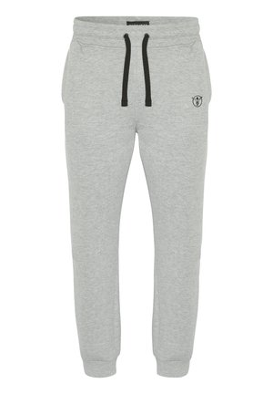 Lysegrå joggingbukser med sorte snore, elastisk talje, ribkanter ved anklerne, sidelommer og en lille sort logo på højre lår.