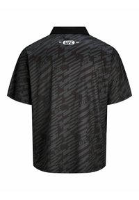 Polo noir à manches courtes avec un motif subtil du logo UFC, col noir uni et ourlet droit. Tissu lisse et léger avec un design moderne.