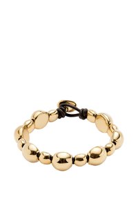 Pulsera de color dorado con cuentas lisas y redondeadas de distintos tamaños, ensartadas en un cordón negro ajustable. Diseño minimalista.