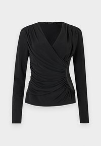 Melna gara piedurkne blūze ar apvērtnes dizainu, kurai ir pieguloša auduma un sakrātā apdare sānos. Gluda tekstūra, vienkārša kakla izgriezums.