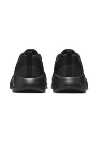 Schwarze Sportschuhe mit einem strukturierten Netzoberteil, abgerundetem Absatz und flexibler Gummisohle. Verfügt über einen Zuglasche hinten für leichtes Anziehen.