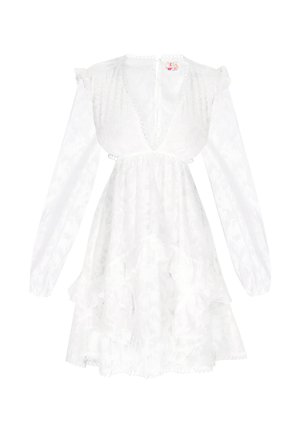 White dress with long sleeves, deep V neckline, textured floral pattern, ruffled hem, and delicate trim details. Soft fabric with sheer accents.