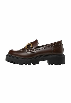 Brown leather loafer with a buckle accent, featuring a thick black rubber sole with tread patterns for traction, sleek design.