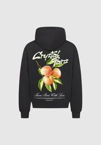 Felpa nera con un grafico colorato di pesche e foglie verdi sul retro. Il testo recita "Crystal Paris" e "Da Parigi con Amore."