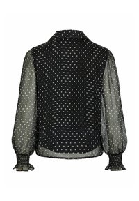 Zwarte blouse met witte polka dots. Heeft doorschijnende pofmouwen, een kraag en geplooide manchetten. Stof lijkt lichtgewicht en gestructureerd.