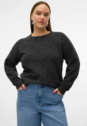 Dark gray knit sweater with a round neckline and long sleeves, paired with light blue denim jeans. Simple, textured fabric with ribbed cuffs.