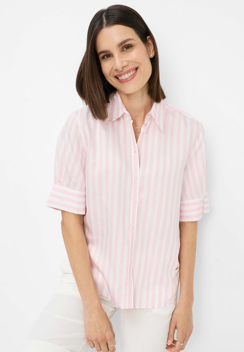 Lightweight, short-sleeve button-up shirt featuring alternating pink and white vertical stripes, with a collar and rolled sleeve cuffs.
