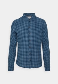 Blauwe en zwarte geblokte lange mouwen shirt met een kraag, knoopsluiting en een klein logo op de borst. Katoenachtige textuur.