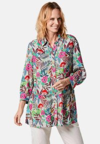 Floral Hemd mit Knöpfen aus leichtem Stoff, mit lebendigen Mustern in Pink, Grün und Blau, Dreiviertelärmel und lockerer Passform.