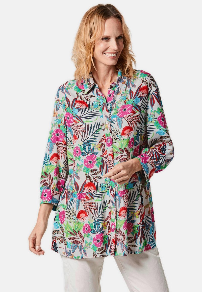 Floral Hemd mit Knöpfen aus leichtem Stoff, mit lebendigen Mustern in Pink, Grün und Blau, Dreiviertelärmel und lockerer Passform.