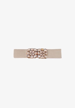 Beige elastic belt with a rectangular cluster of large and small clear and light brown gemstones in the center.