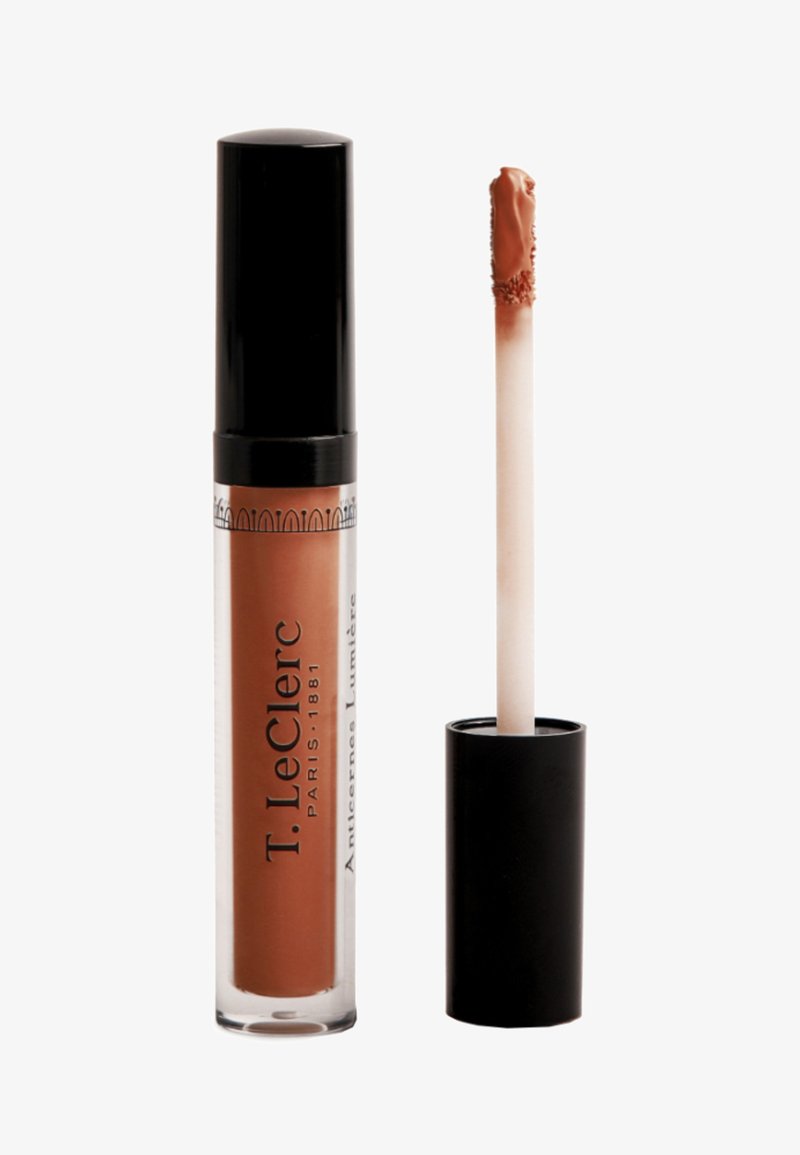 Liquid lipstick in a clear tube with black cap. Color: nude brown. Includes a separate, white-tipped applicator wand for easy use.