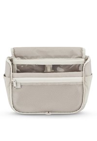 Vaalean beige-värinen vetoketjullinen järjestelijä, jossa on verkkomainen etutasku, useita osastoja ja teksturoitu kangas. Kompakti muotoilu, jossa on hillitty kuvio.