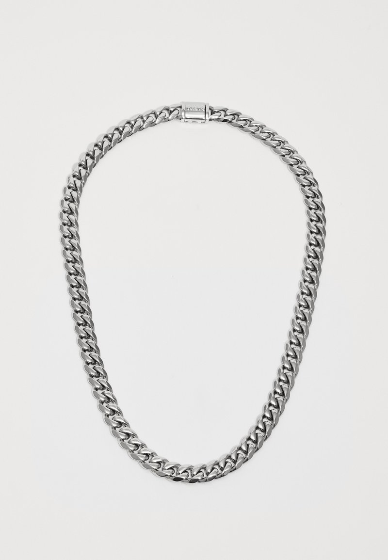 Silver-tone chain necklace with thick, flat curb links and a rectangular clasp engraved with a brand name on a white background.