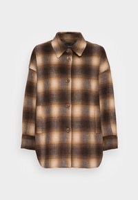 Ruskean ruudullinen takki, joka on valmistettu pehmeästä kankaasta. Siinä on suuret napit, kauluksellinen kaula-aukko ja kaksi sivutaskua. Yli-iso muotoilu.