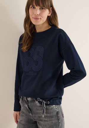 Marineblauwe sweatshirt met ronde hals, lange mouwen en geribbelde boorden. Heeft een blauw grafisch ontwerp op de voorkant en een zoom met trekkoord.
