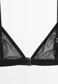 Black bra featuring a triangular design with mesh fabric, adjustable straps, and metal hardware accents on the closure.