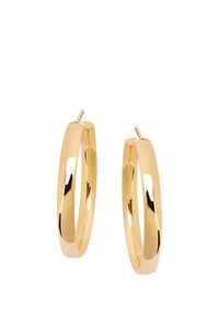 Złote kolczyki w kształcie kół z gładkim, polerowanym wykończeniem. Zaokrąglony, gruby design z pewnym zapięciem na sztyft. Brak widocznych wzorów lub akcentów.