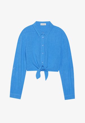 Cropped, long-sleeve button-up shirt in bright blue, featuring a knotted front design and soft fabric with a slight texture.