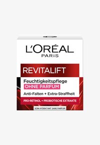 L'Oréal Revitalift krämförpackning i vitt med röda accenter, med fet svart text. Innehåller "Återfuktande kräm utan doft" och detaljer om ingredienser.