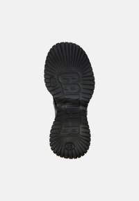 Black rubber shoe sole with textured ridges and deep grooves. Features the raised logo "CAMPPER" and size "38" prominently.