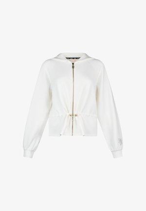 Valge lukuga kapuutsiga dressipluus, millel on reguleeritav nööriga talje, pikad varrukad mansettidega ja peen tikand vasaku varruka mansetil.