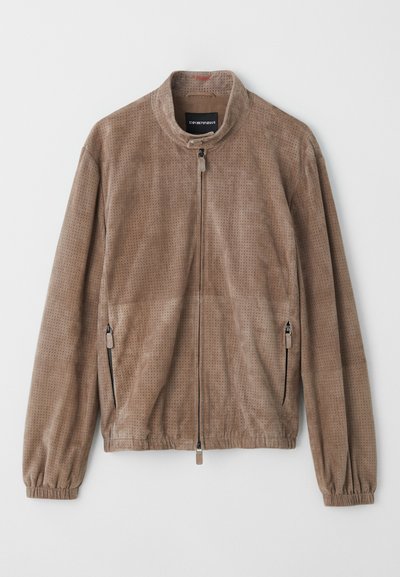 Brown perforated jacket with a stand collar, front zip closure, and side zip pockets; made of soft suede-like material.