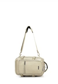 Beige syntetická taška přes rameno s nastavitelným popruhem, dvěma zipovými přihrádkami a zesílenými uchy. Texturovaný povrch.