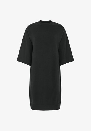 Fekete, oversized t-shirt ruha kerek nyakkivágással és rövid ujjakkal. Puha anyagból készült, laza szabású és egyenes szegéllyel.