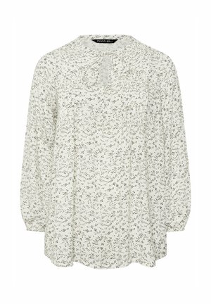 Blusa bianca a maniche lunghe con piccolo motivo floreale nero, scollatura rotonda con apertura a goccia e dettaglio con laccio, e polsini leggermente arricciati.