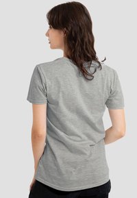 Gray cotton t-shirt with short sleeves and a round neckline, featuring a smooth texture and a simple design, viewed from the back.