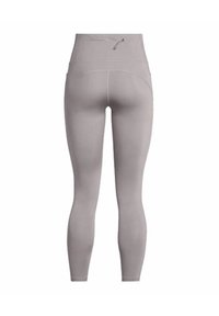 Leggings gris taille haute en tissu extensible, avec une texture lisse et une poche zippée discrète à l'arrière.