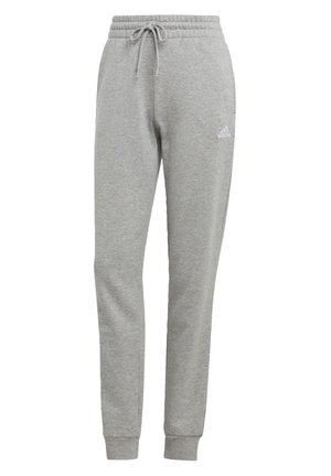 Pantalon de survêtement Adidas gris clair avec taille élastique, cordon de serrage, chevilles resserrées et petit logo Adidas blanc sur le haut de la cuisse gauche.
