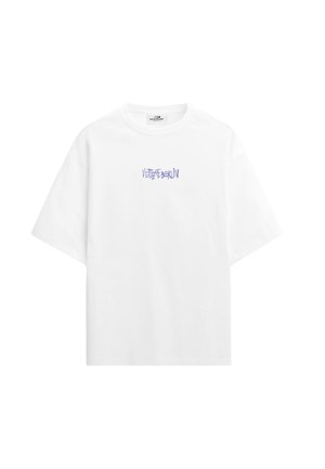 Maglietta bianca a maniche corte con la scritta viola "Vertige Berlin" stampata al centro del petto.