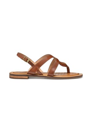 Sandalia plana de cuero marrón con correas entrecruzadas, lazo para el dedo y hebilla ajustable en el tobillo sobre una suela lisa.