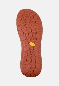 Vibram shoe sole in orange rubber with circular and oval traction patterns, featuring a yellow logo and size indicator 42.