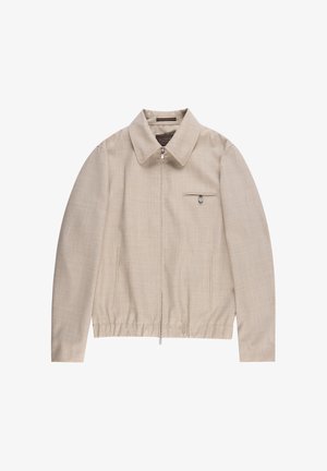 Beige lichtgewicht jack met een kraag, ritssluiting en een borstzak met drukknop. Gestructureerde stof en elastische zoom.