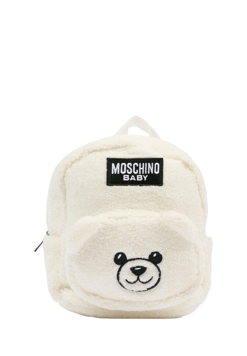Zaino in peluche color crema con design a faccina d'orso, dettagli ricamati e maniglia superiore per il trasporto. Logo del marchio in evidenza.