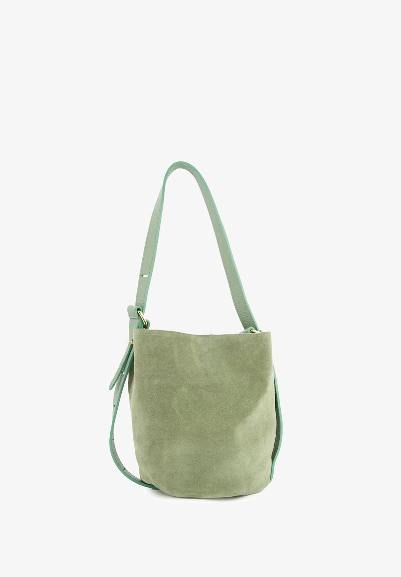 Green suede bucket bag with a smooth leather strap, featuring a simple design and a soft texture. Accents include gold hardware details.