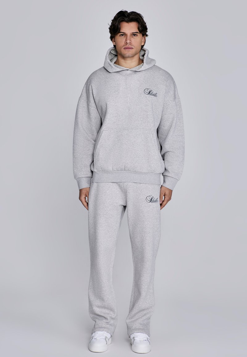 Gray hoodie and sweatpants set made from soft fabric; features a front pocket, ribbed cuffs, and logo embroidery on the chest and leg.