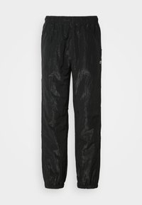 Schwarze wasserdichte Hose aus leichtem, strukturiertem Material. Verfügt über einen elastischen Bund und Ösen zur Belüftung.